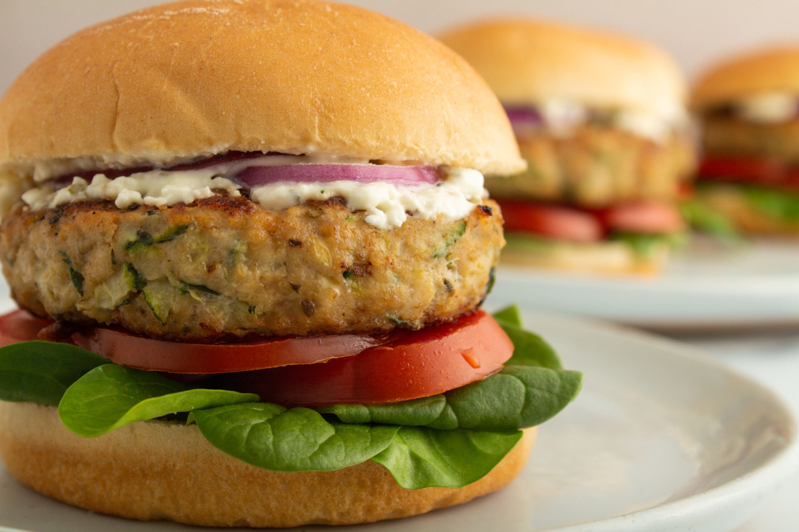 Farmer Focus Organic Ground Chicken Burger with tomato and spinach.